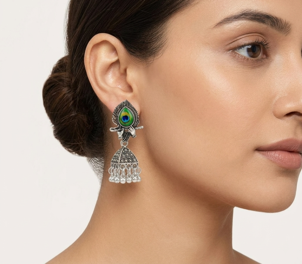 Silver Peacock Feather Jhumka Earrings – Krishna Flute Motif & Filigree Beads